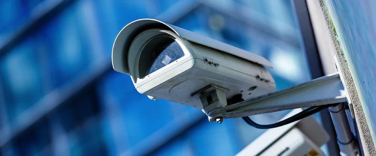 Security camera mounted on a commercial building exterior